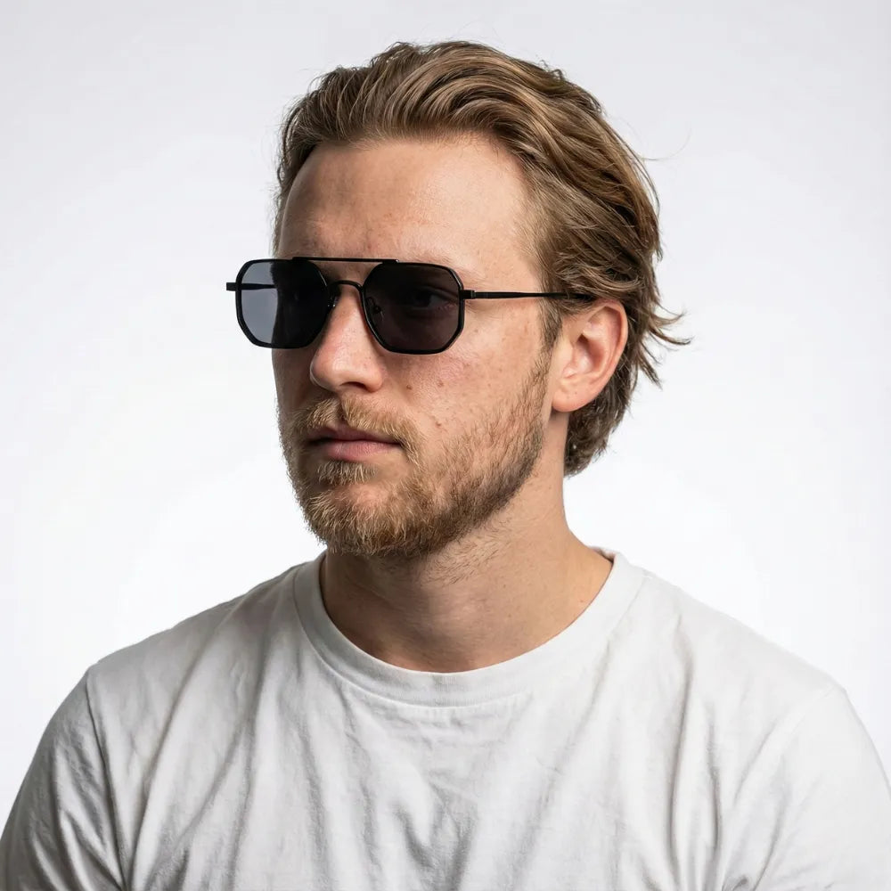 Hexagonal aviator metal sunglasses, model portrait — HARO Sorrento Grand Tour