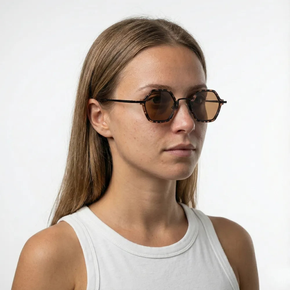 Small hexagonal acetate-metal sunglasses, close-up detail — HARO Cap-Ferrat 1925